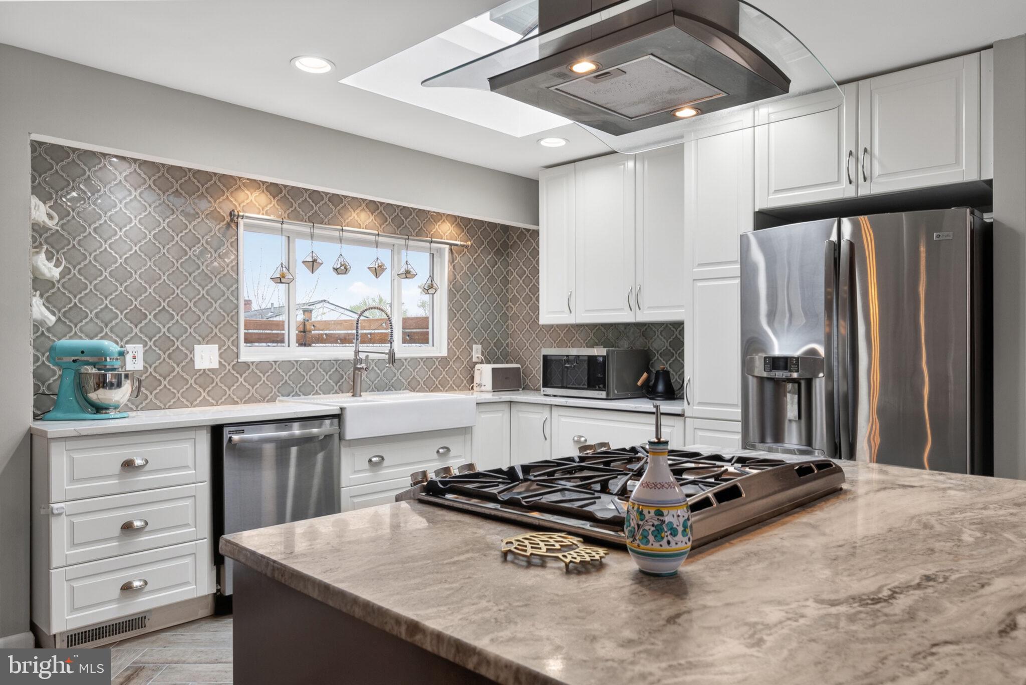 5939 Craft Alexandria, VA 22310 - Photo 7 of 54 a kitchen with stainless steel appliances a stove refrigerator and sink