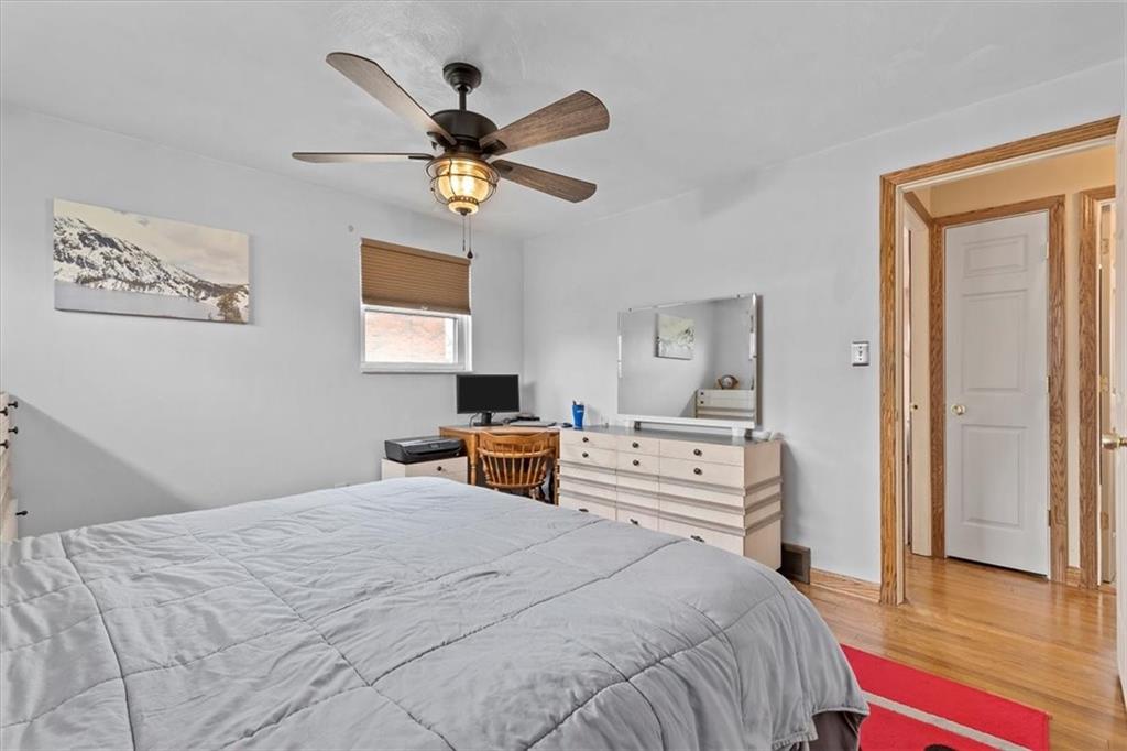 666 Lindsay Road Carnegie, PA 15106 - Photo 12 of 25 a bedroom with a bed and a chandelier