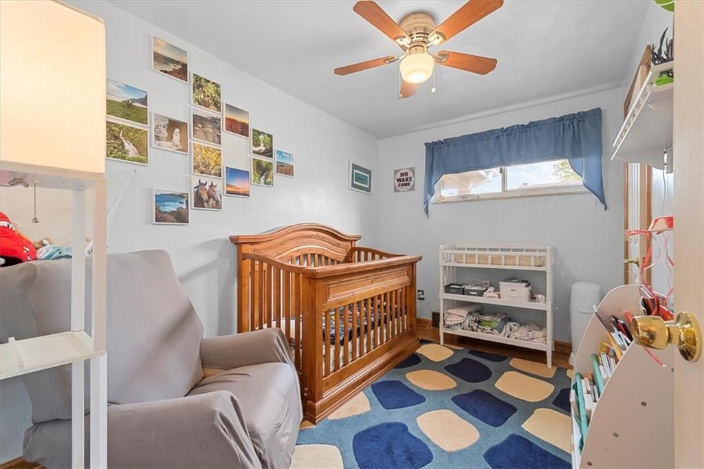 666 Lindsay Road Carnegie, PA 15106 - Photo 14 of 25 a bedroom with furniture and a baby crib