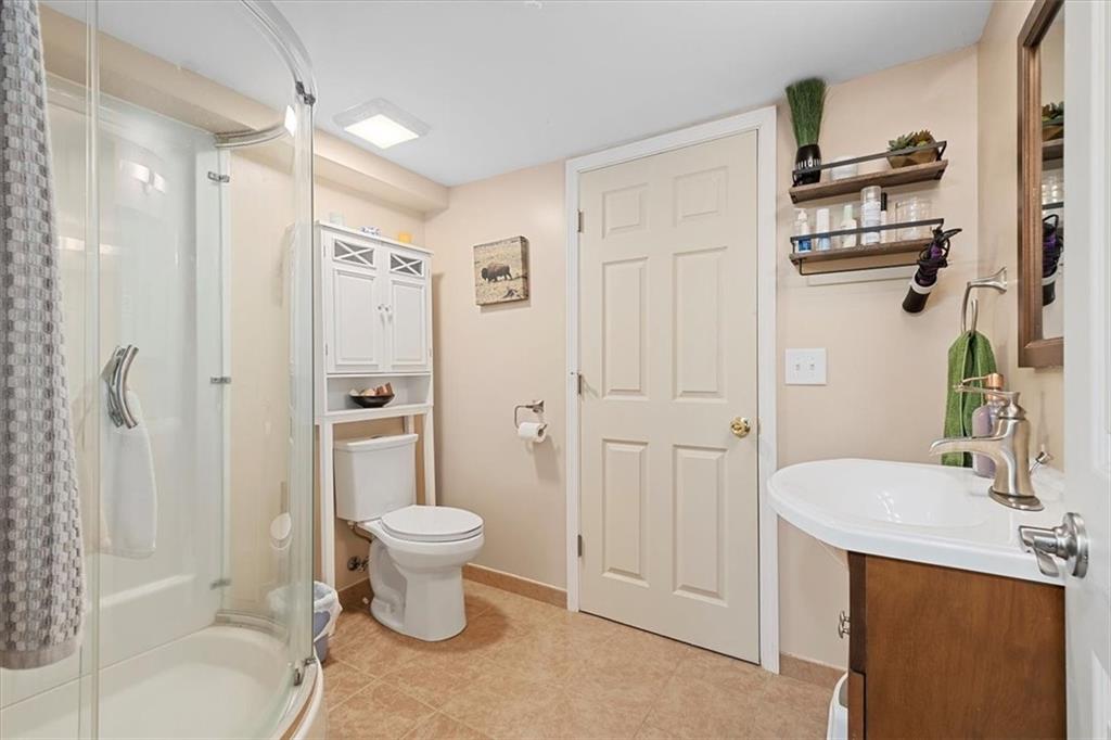 666 Lindsay Road Carnegie, PA 15106 - Photo 18 of 25 a bathroom with a sink toilet and shower
