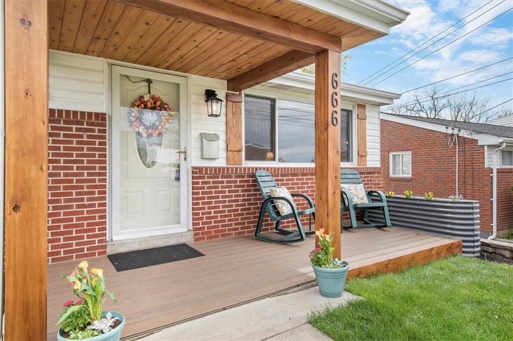 666 Lindsay Road Carnegie, PA 15106 - Photo 2 of 25 a front view of a house with a garage