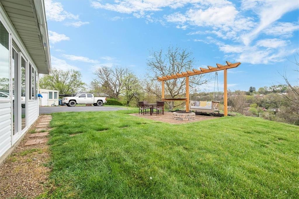 666 Lindsay Road Carnegie, PA 15106 - Photo 22 of 25 a view of a yard with table and chairs and a big yard