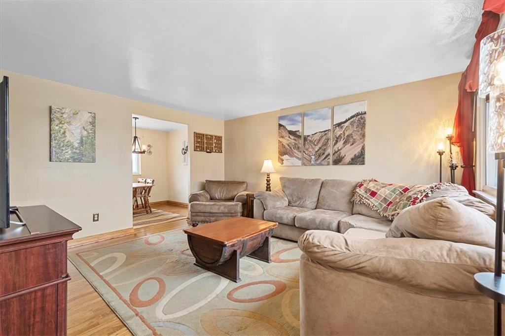 666 Lindsay Road Carnegie, PA 15106 - Photo 5 of 25 a living room with furniture and a flat screen tv