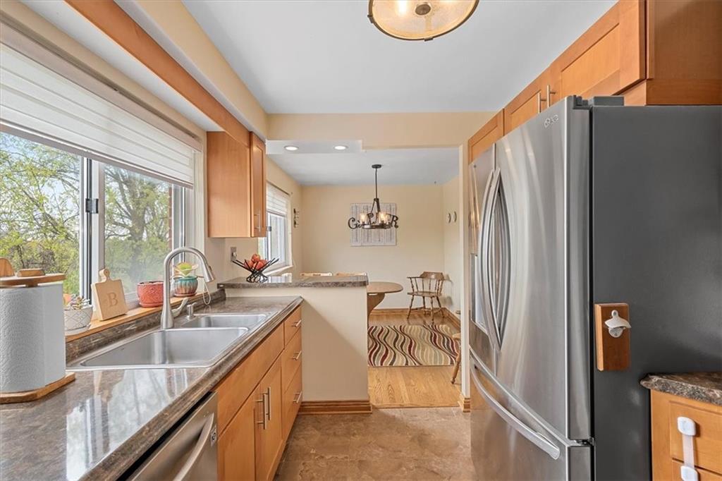 666 Lindsay Road Carnegie, PA 15106 - Photo 10 of 25 a kitchen with sink refrigerator and window