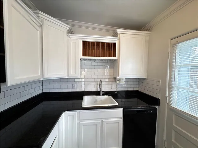 a kitchen with a sink and a window