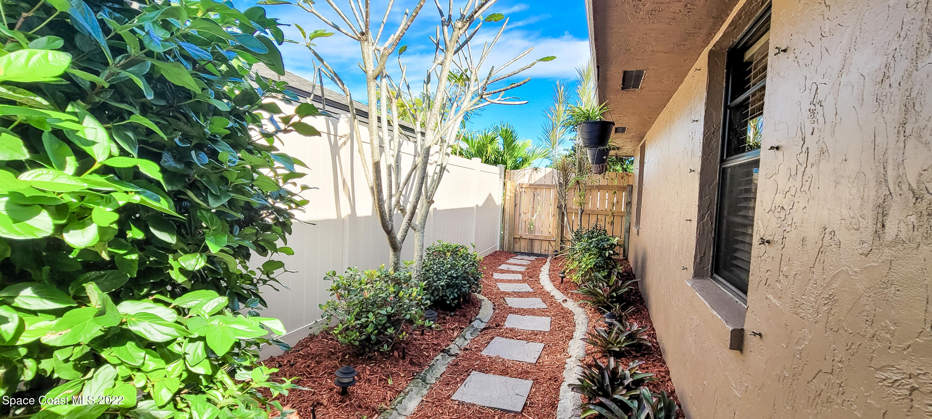 845 Raintree Avenue Rockledge, FL 32955 - Photo 40 of 78 Left side of home