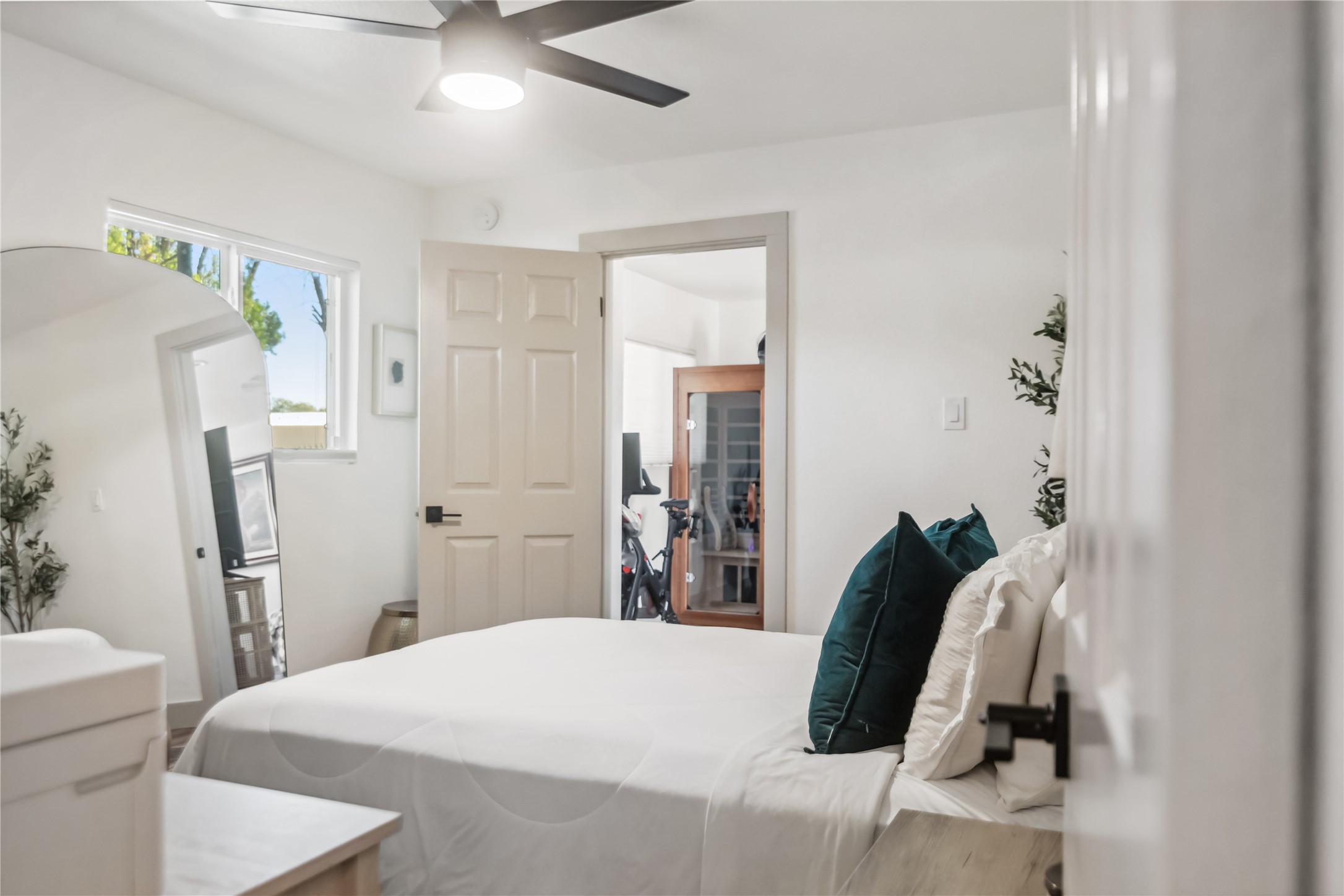 1313 East 52nd Street, Unit 101 Austin, TX 78723 - Photo 6 of 14 a bedroom with a bed and a couch
