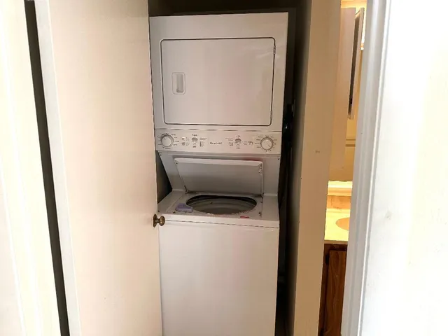 a bathroom with a double vanity sink toilet mirror and shower