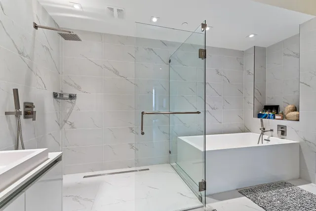 a bathroom with a bathtub and a sink