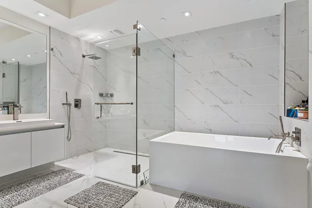 a bathroom with a bathtub and a sink