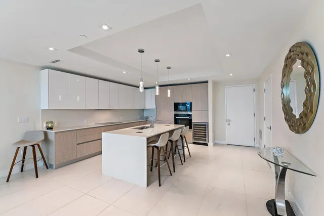 a kitchen with a table and chairs