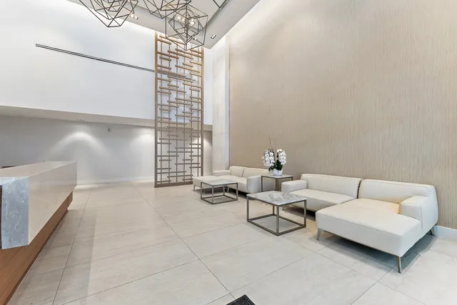 a living room with furniture and white walls