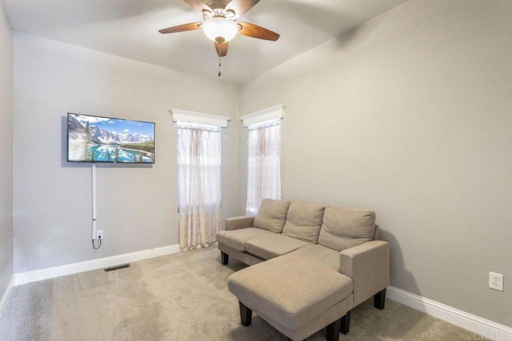 3505 Alpine Boulevard, Unit 15 Alpine, CA 91901 - Photo 14 of 23 a living room with furniture and a large window