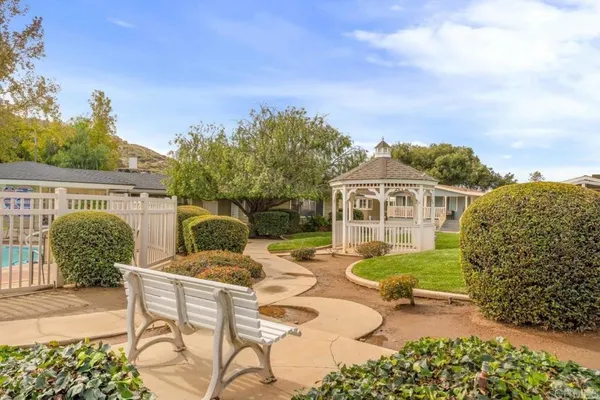a view of a chairs and table in patio