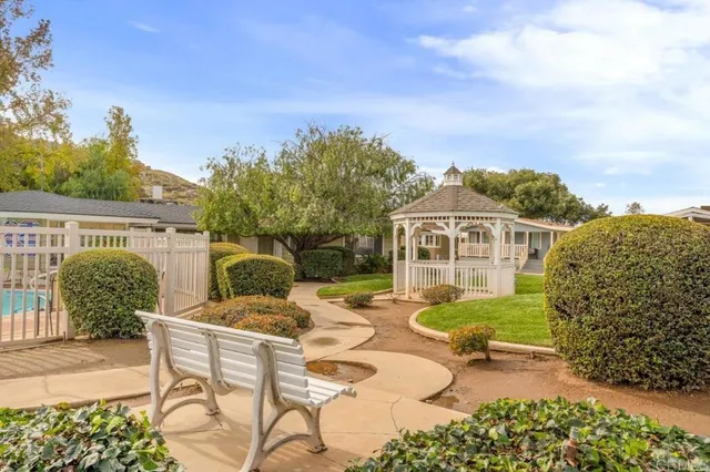 a view of a chairs and table in patio
