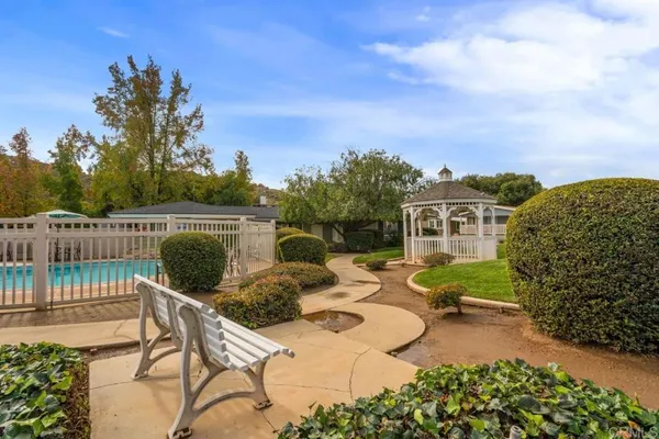 a view of a swimming pool with a lake view