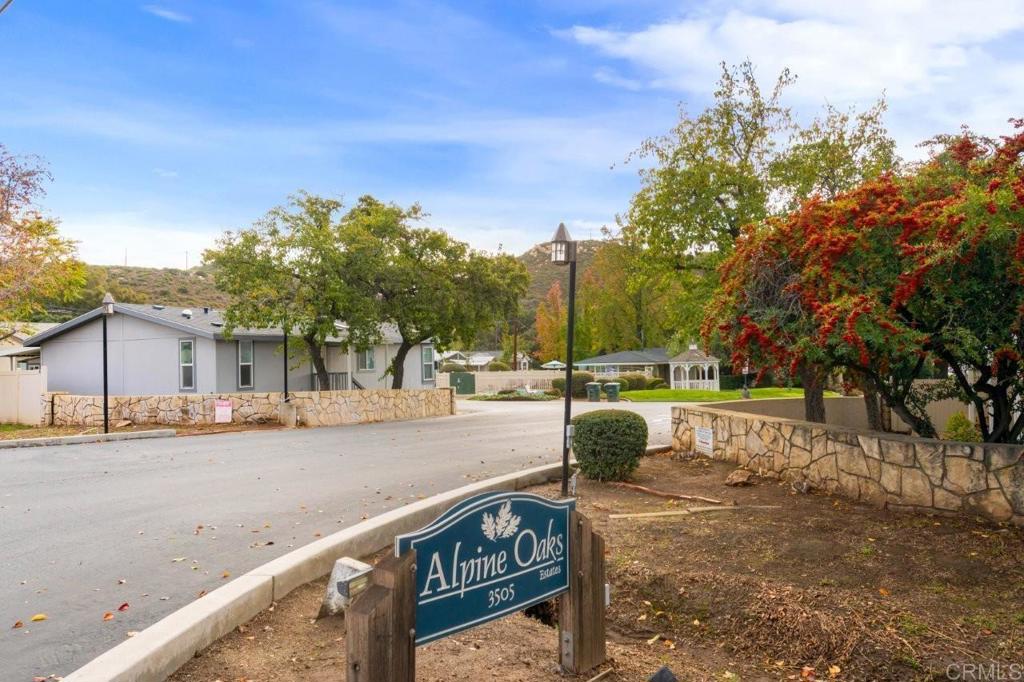 3505 Alpine Boulevard, Unit 15 Alpine, CA 91901 - Photo 6 of 23 a view of a street with a building in the background