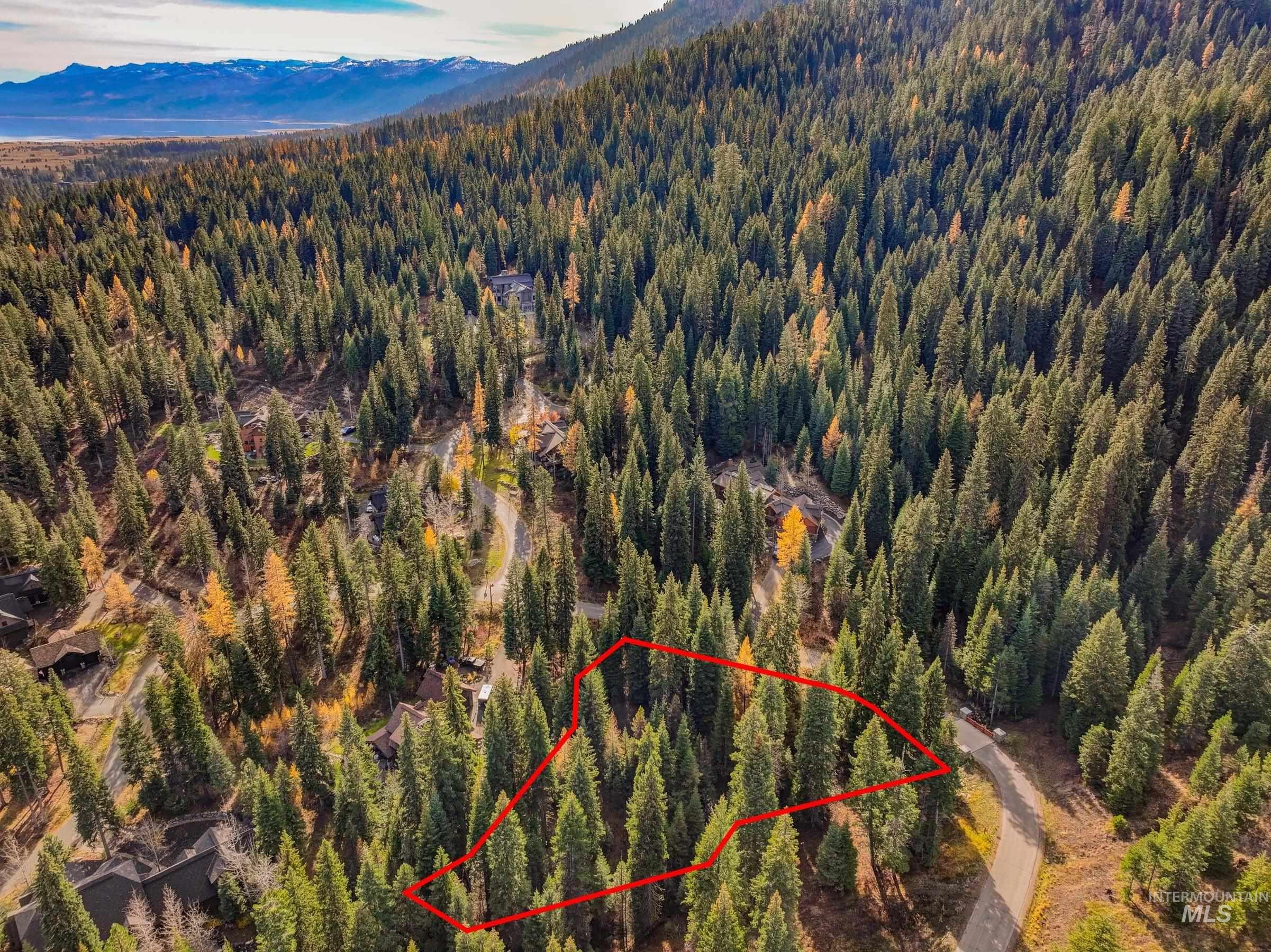150 Pinnacle Court Cascade, ID 83611 - Photo 14 of 30 Aerial view of property and surrounding area featuring property parcel outlined and a mountainous background