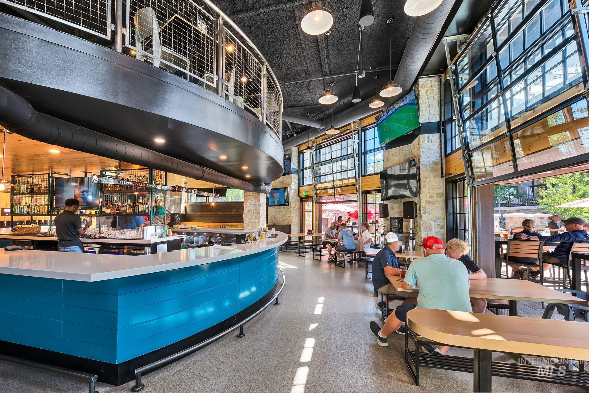 150 Pinnacle Court Cascade, ID 83611 - Photo 27 of 30 Indoor wet bar with a high ceiling, a paneled ceiling, plenty of natural light, and butcher block counters