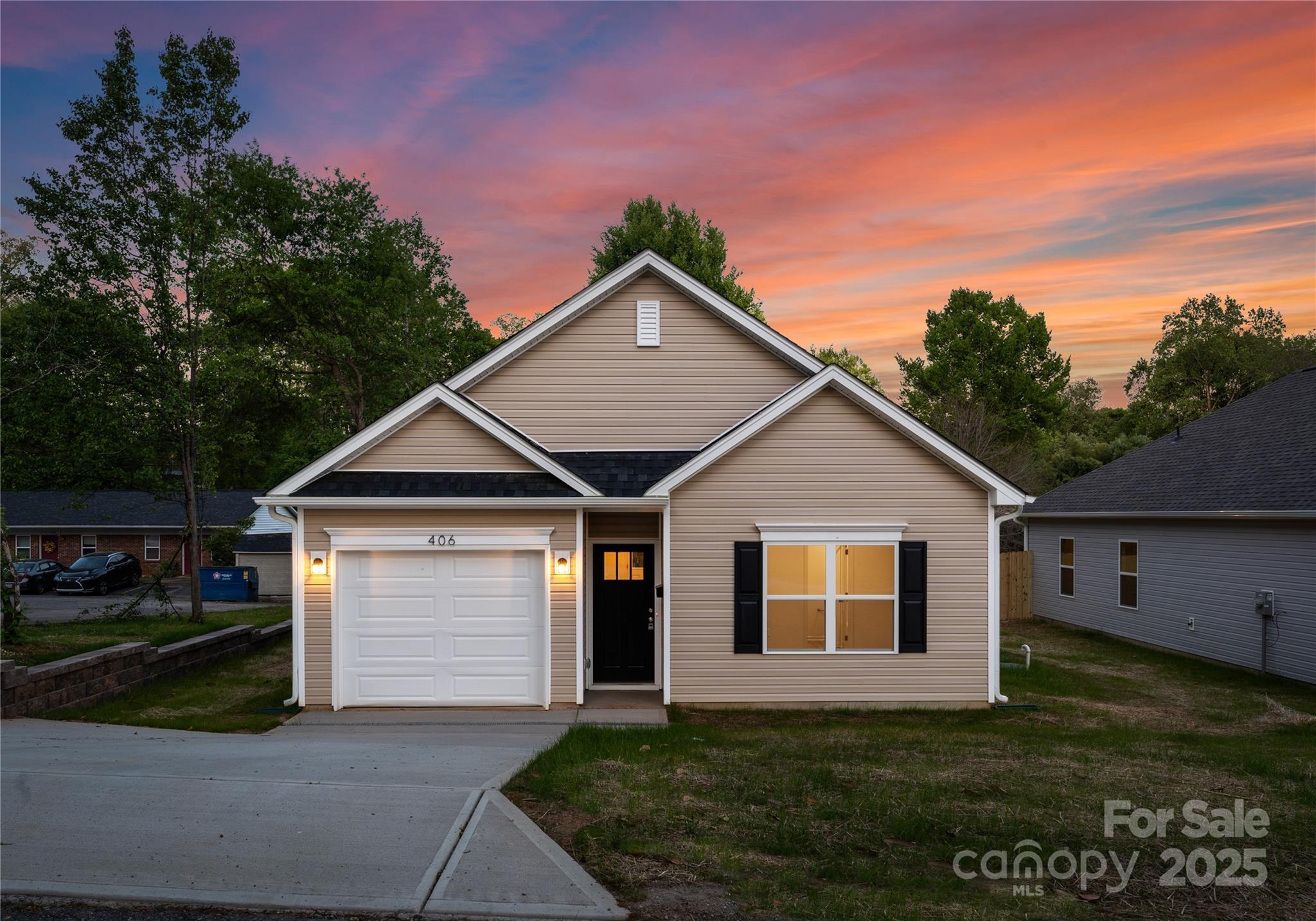 a front view of a house with a yard
