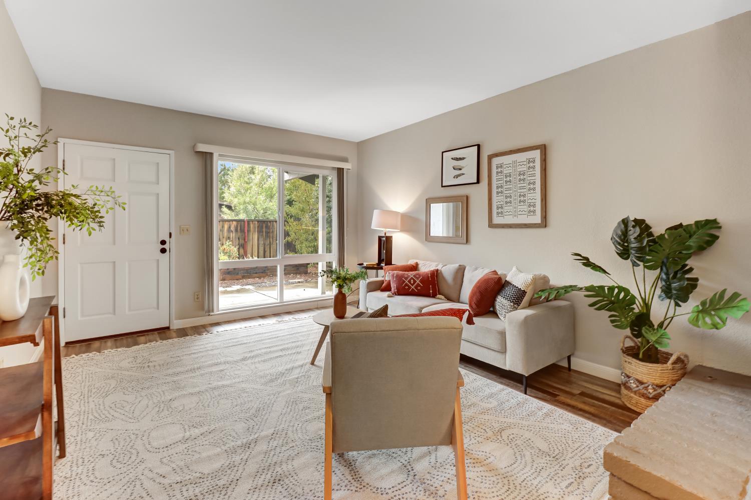 2317 East 8th Street Davis, CA 95618 - Photo 11 of 42 a living room with furniture potted plant and a window