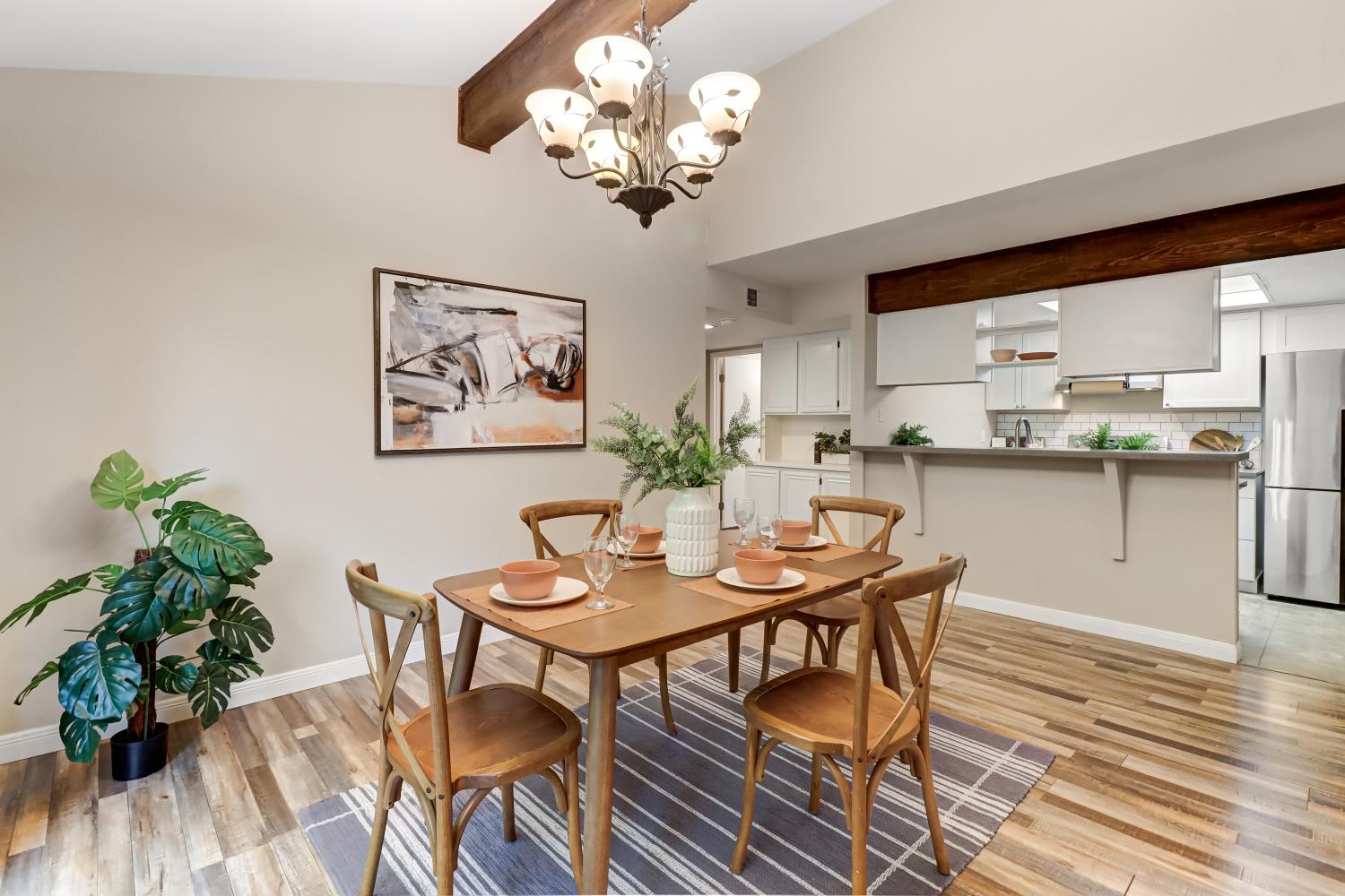 2317 East 8th Street Davis, CA 95618 - Photo 15 of 42 a dining room filled chandelier and wooden floor