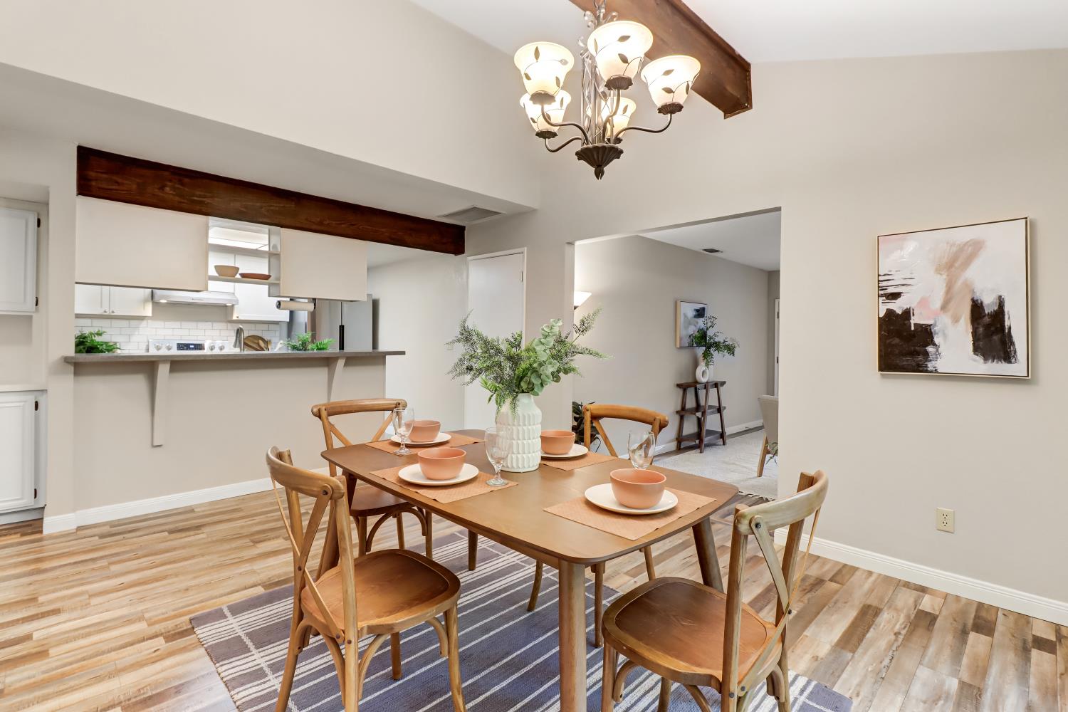 2317 East 8th Street Davis, CA 95618 - Photo 16 of 42 a view of a dining room with furniture wooden floor and chandelier
