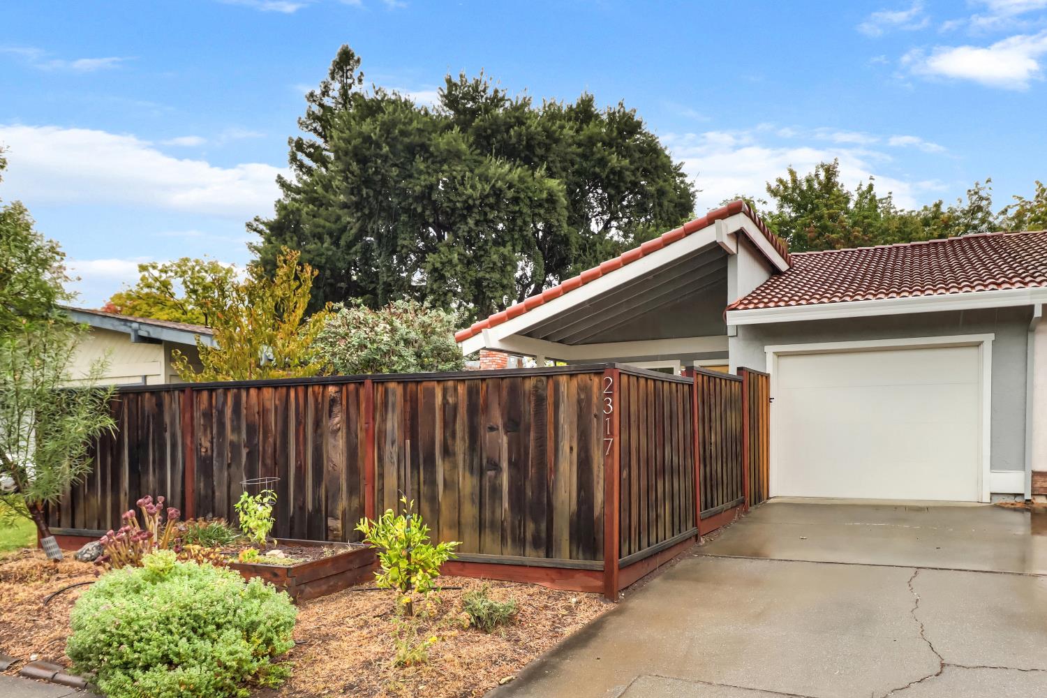 2317 East 8th Street Davis, CA 95618 - Photo 2 of 42 a backyard of a house with table and chairs