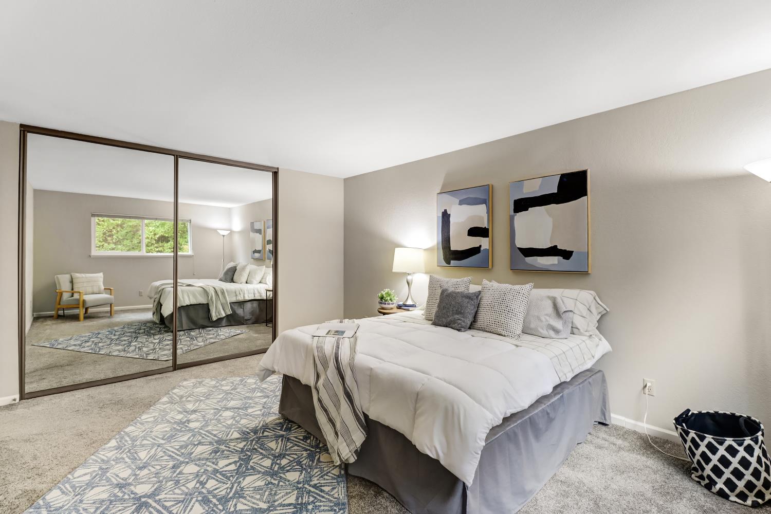 2317 East 8th Street Davis, CA 95618 - Photo 25 of 42 a bedroom with a bed and a large mirror