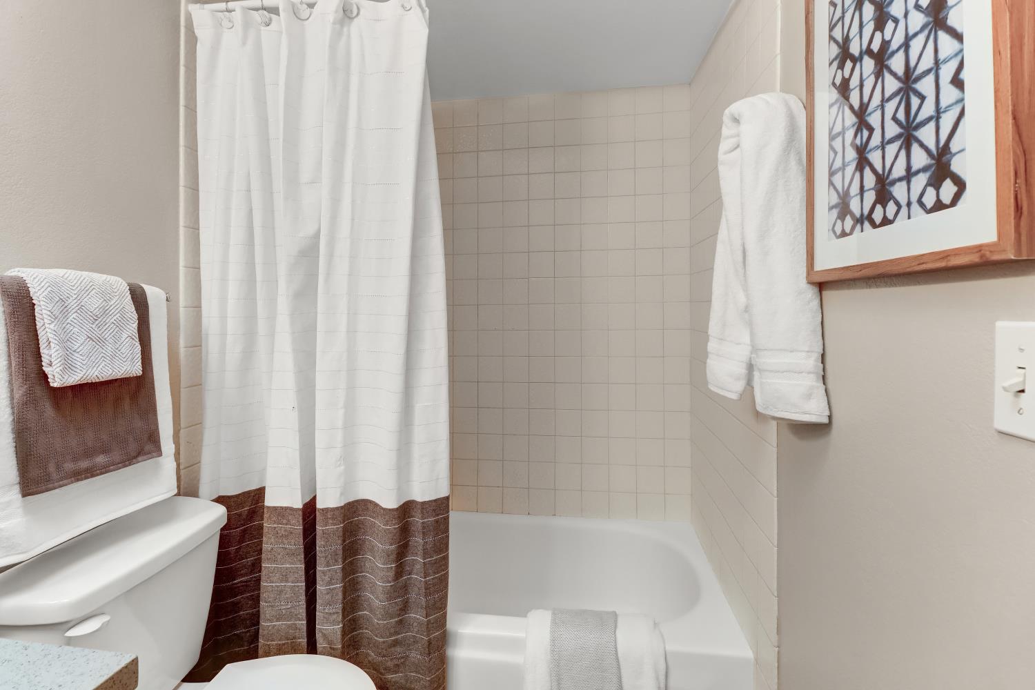 2317 East 8th Street Davis, CA 95618 - Photo 28 of 42 a bathroom with a bathtub and shower