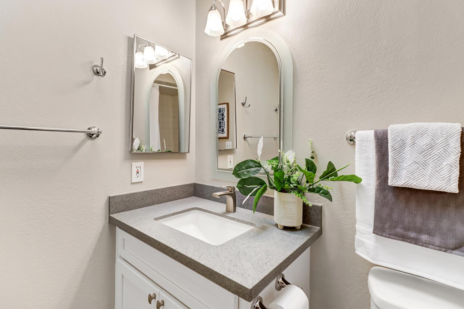 2317 East 8th Street Davis, CA 95618 - Photo 29 of 42 a bathroom with a sink and a mirror