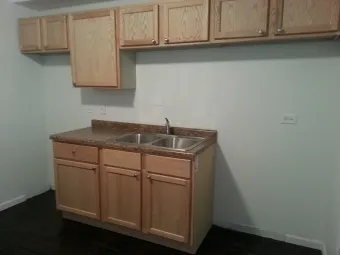 a kitchen with granite countertop cabinets and a sink