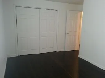 an empty room with wooden floor