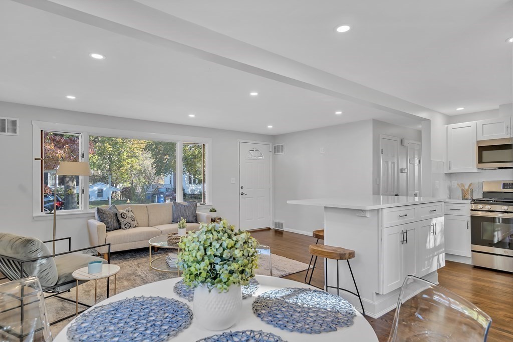 9 Cutter Road Boston, MA 02132 - Photo 6 of 17 a living room with furniture and a large window