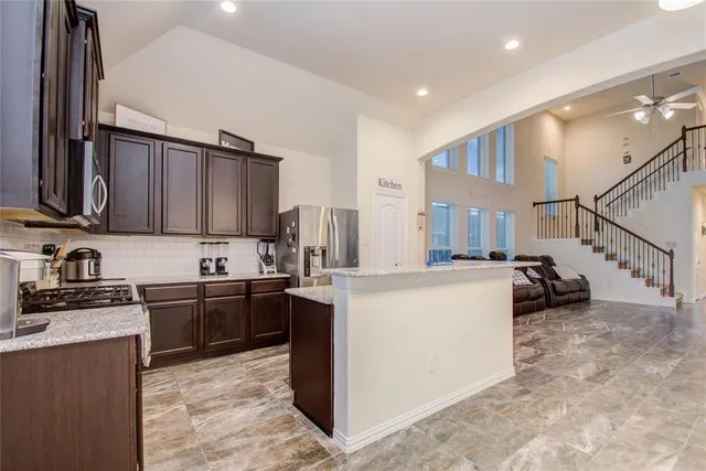 a kitchen with cabinets a sink and appliances