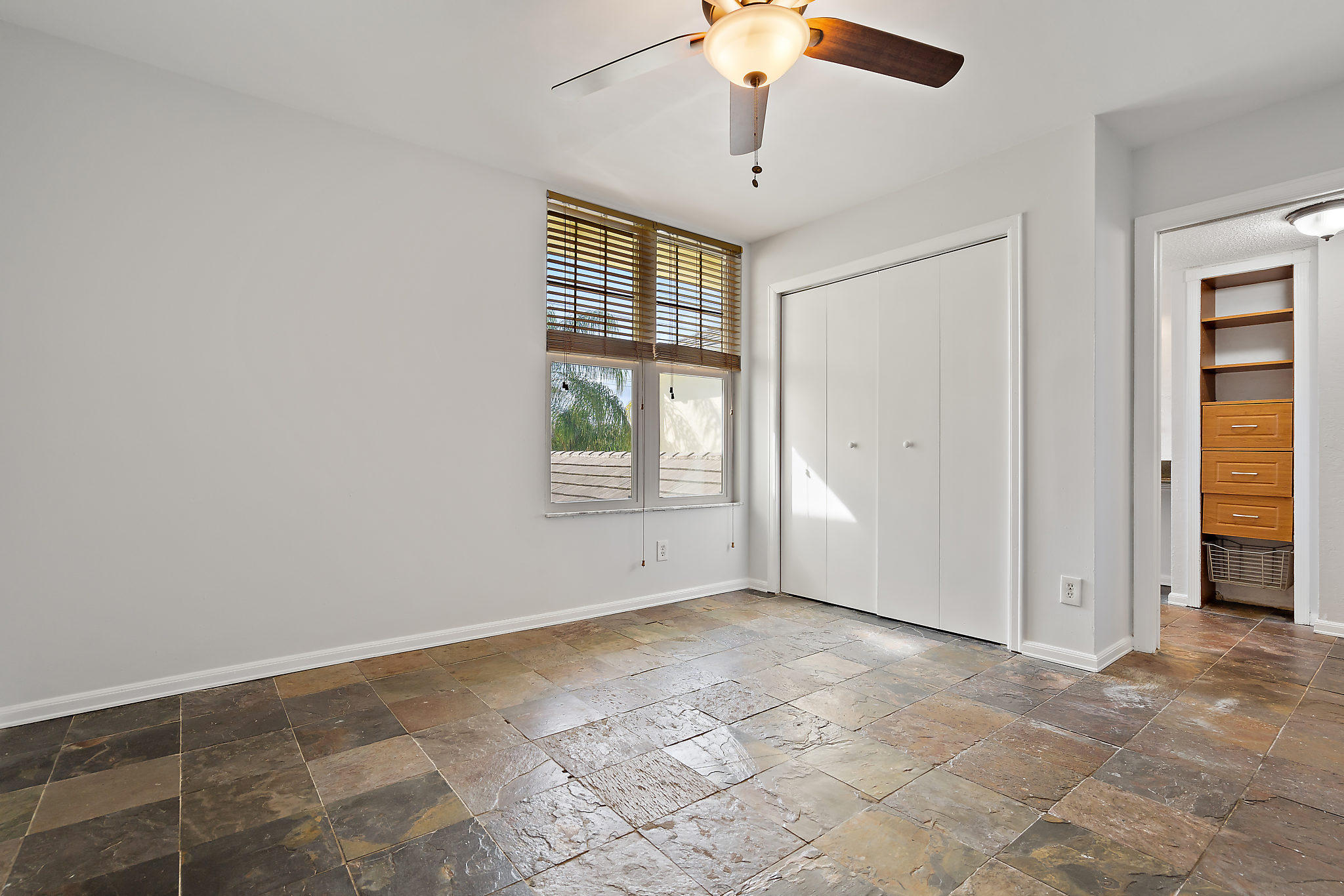 1906 Mainsail Circle Jupiter, FL 33477 - Photo 13 of 34 an empty room with windows and fan