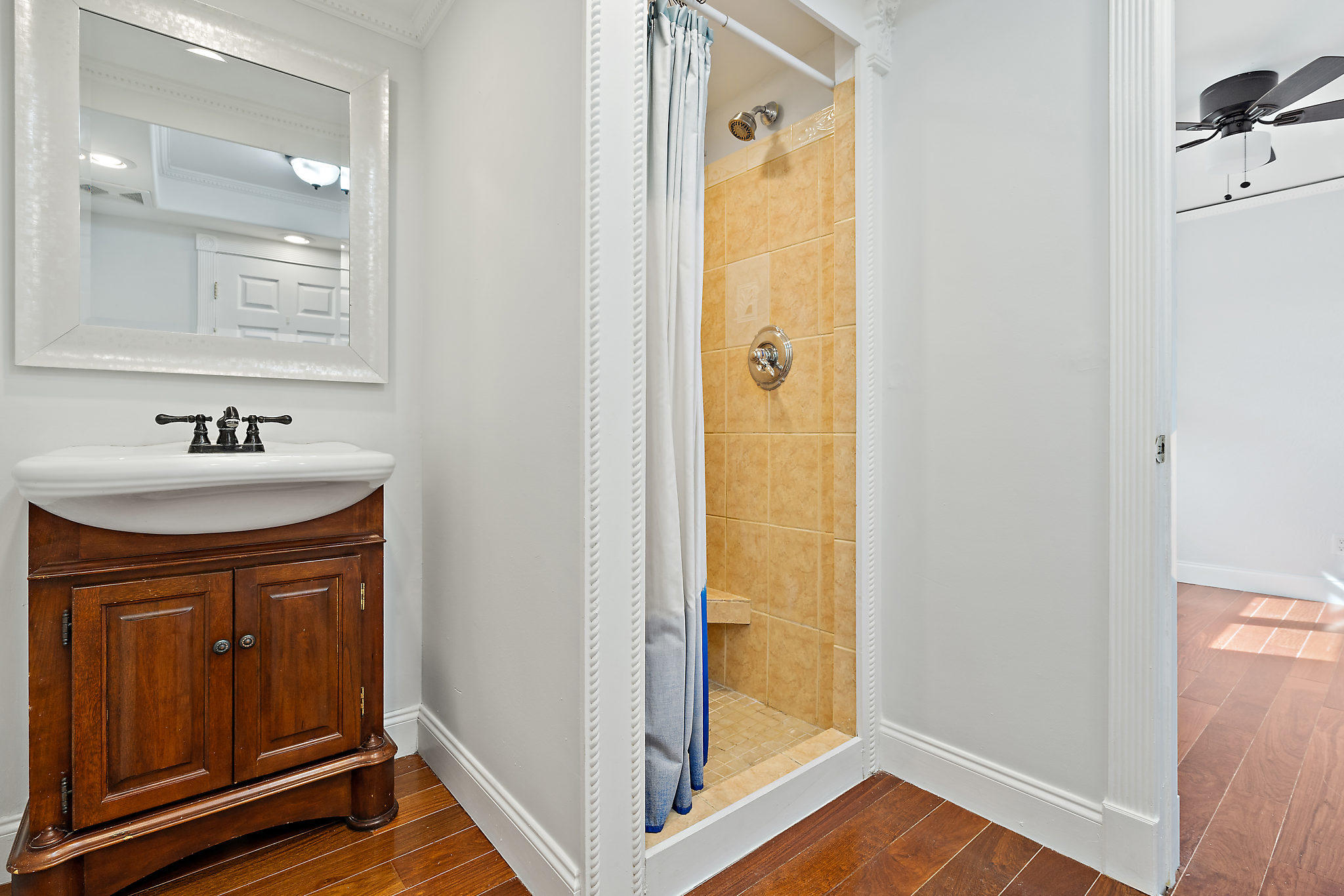 1906 Mainsail Circle Jupiter, FL 33477 - Photo 20 of 34 a bathroom with a sink a mirror and shower