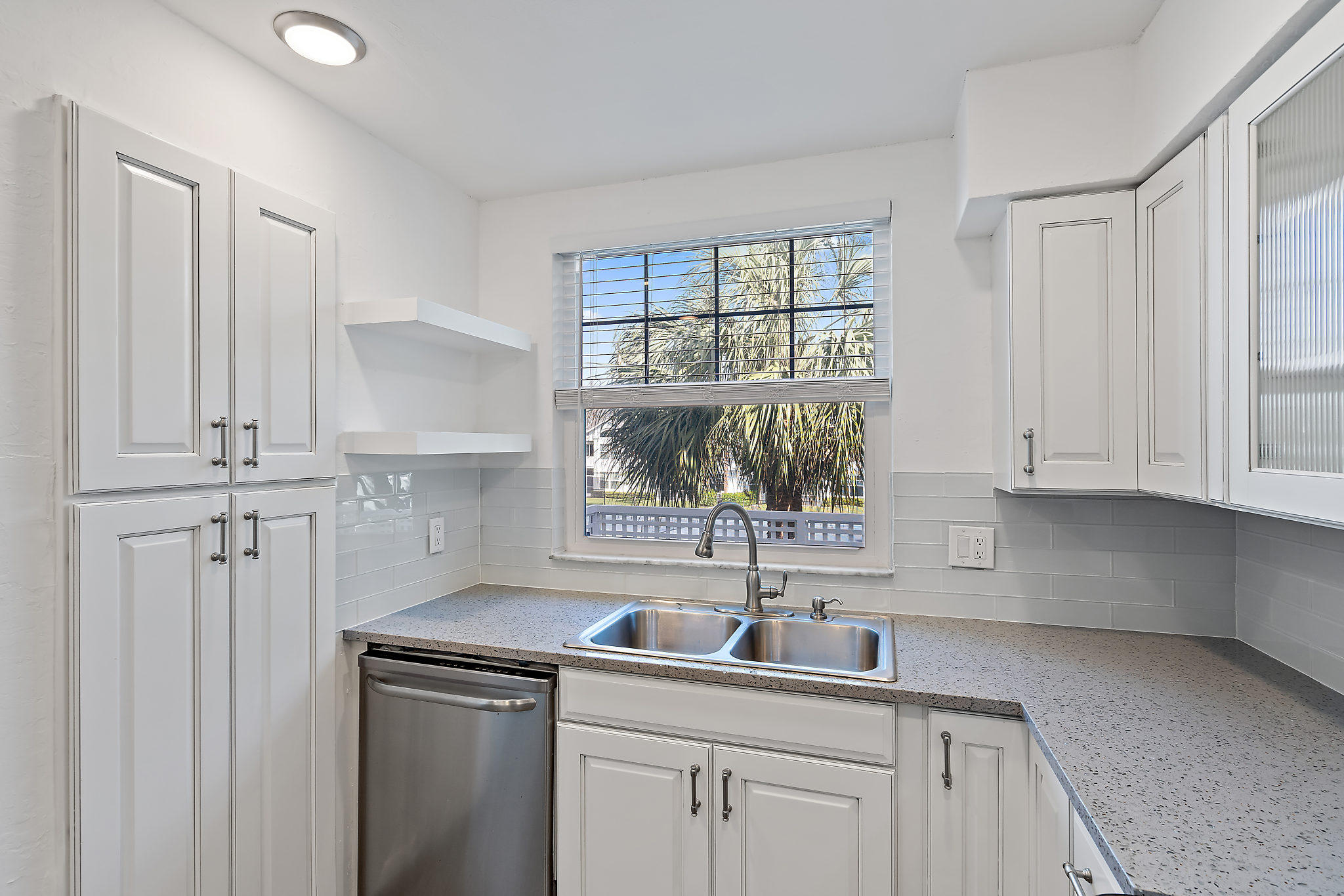 1906 Mainsail Circle Jupiter, FL 33477 - Photo 6 of 34 a kitchen with a sink and cabinets