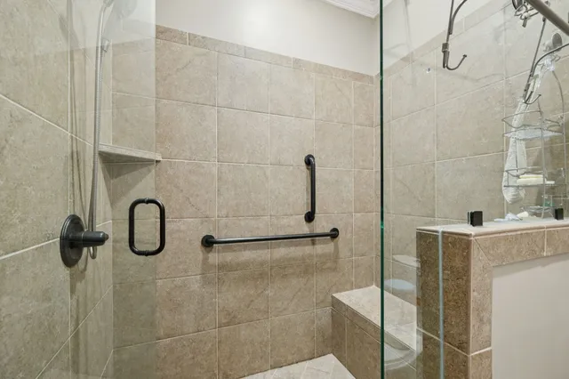 a view of a balcony with wooden chairs