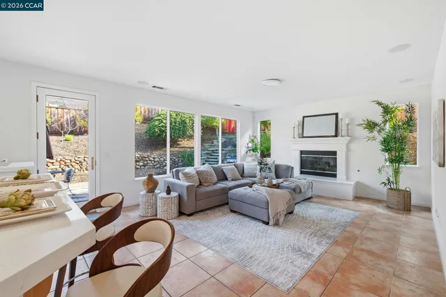 a spacious bedroom with a bed and a couch