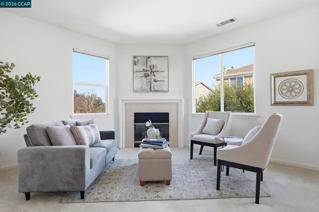 a spacious bathroom with a sink double vanity mirror and a bathtub