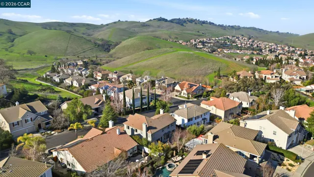 an aerial view of a house with a garden and plants