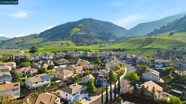 an aerial view of residential house with outdoor space and swimming pool