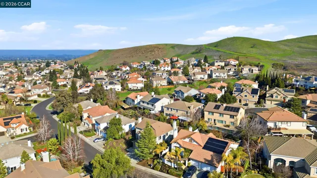 an aerial view of a house with a yard and garden