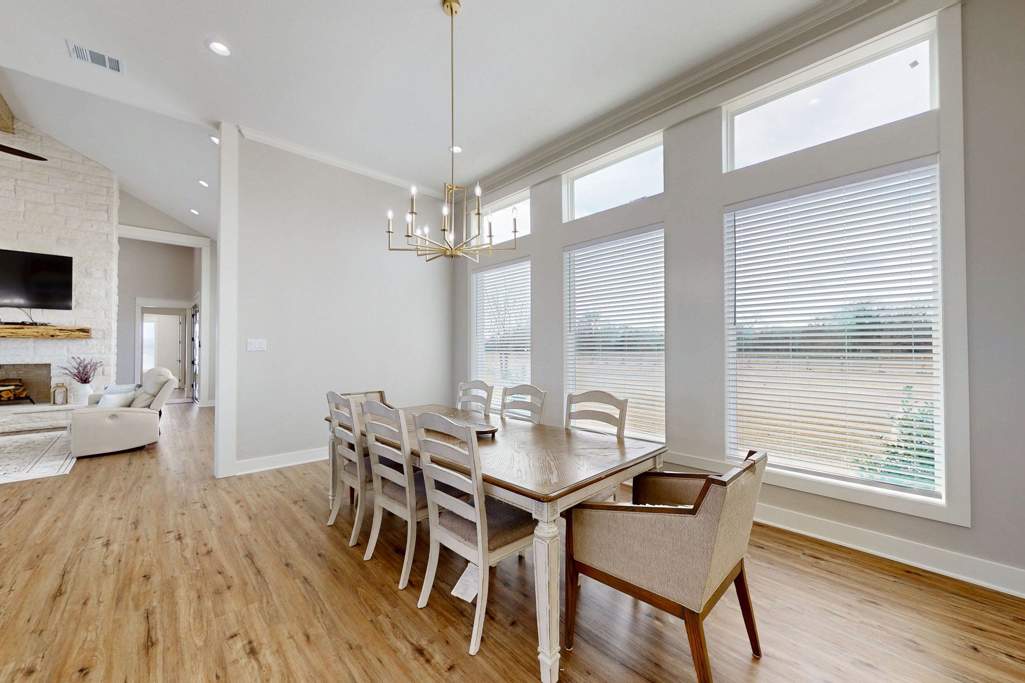 13504 Hudson Farms Road Franklin, TX 77856 - Photo 11 of 49 a view of a dining room with furniture a chandelier and wooden floor