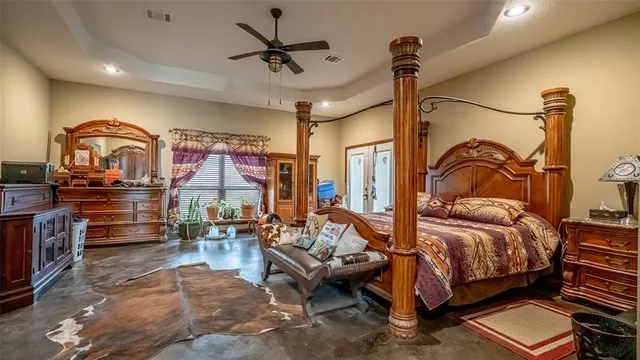 a bedroom with furniture and a chandelier