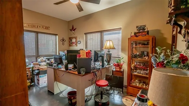 a bathroom with a granite countertop sink and a toilet