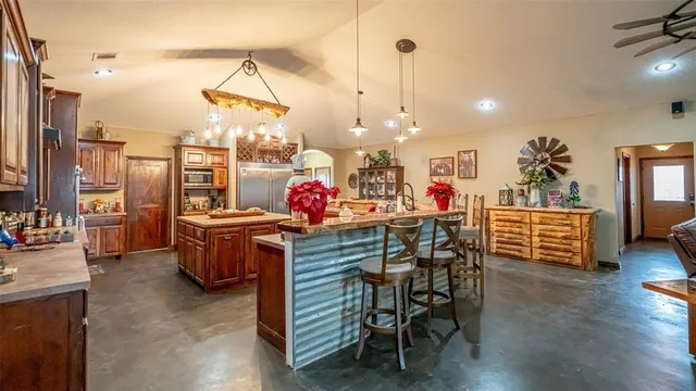 a kitchen with lots of counter top space and appliances