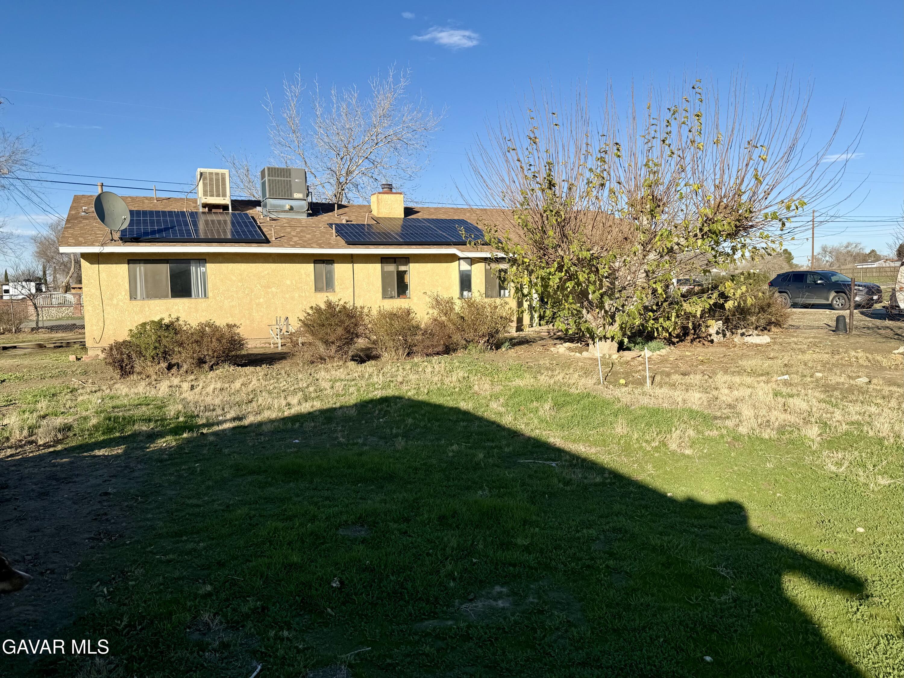 10256 East Ave R 12 Littlerock, CA 93543 - Photo 5 of 21 a view of a house with a yard