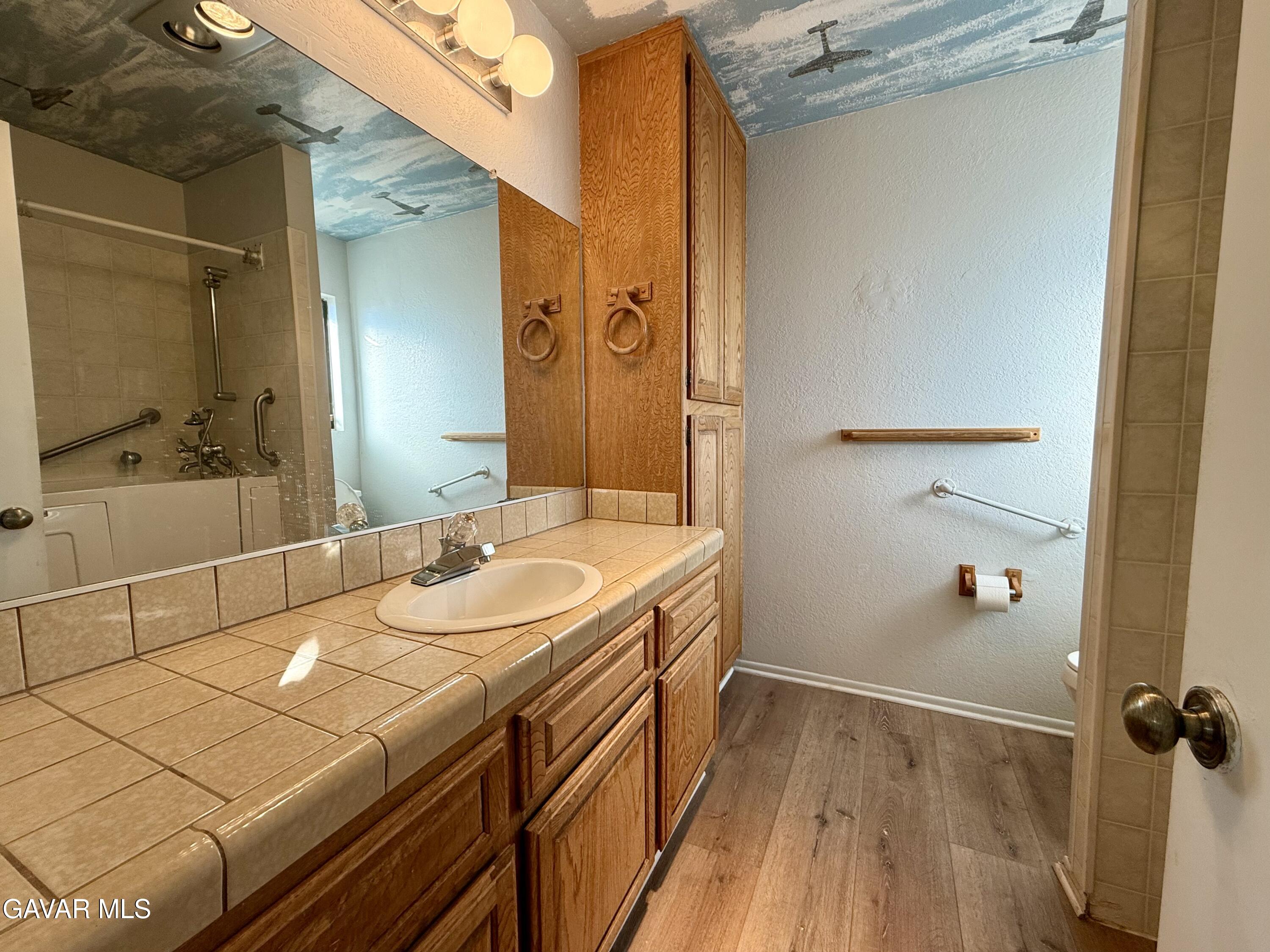 10256 East Ave R 12 Littlerock, CA 93543 - Photo 8 of 21 a bathroom with a sink and a mirror